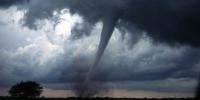 The mention of a tornado conjures up images of raw destructive power. Tornadoes blow houses away as if they were made of paper and have been known to pierce tree trunks with pieces of straw. They descend from clouds in funnel-like shapes that spin violently, particularly at the bottom where they are most narrow, producing winds as high as 500 km/h. Location: Oklahoma 7 miles south of Anadarko.