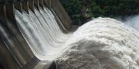 Electric energy in massive quantities is transmitted from this hydroelectric facility, the Srisailam power station located along the Krishna River in India, by the movement of charge—that is, by electric current.