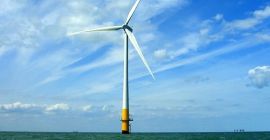 This wind turbine in the Thames Estuary in the UK is an example of induction at work. Wind pushes the blades of the turbine, spinning a shaft attached to magnets. The magnets spin around a conductive coil, inducing an electric current in the coil, and eventually feeding the electrical grid.