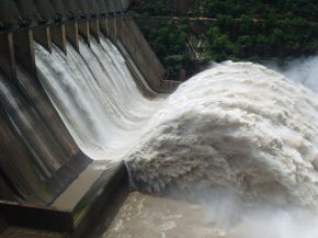 Electric energy in massive quantities is transmitted from this hydroelectric facility, the Srisailam power station located along the Krishna River in India, by the movement of charge—that is, by electric current.